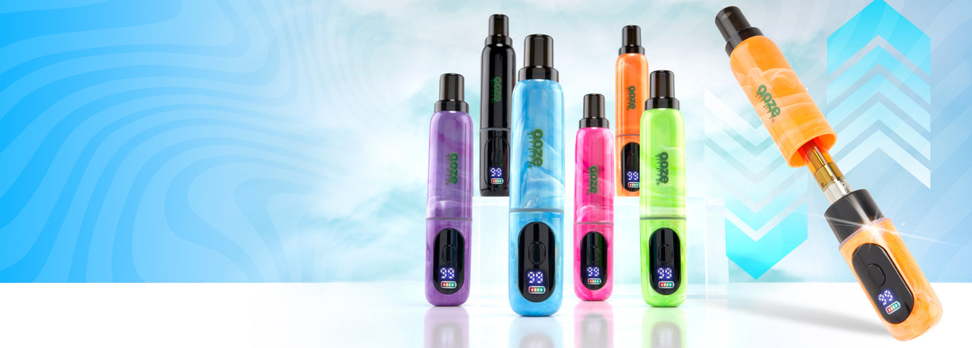 Ooze Hilo 510 Concealed vape devices sitting on a white table surface with blue arrows in the background and clouds.